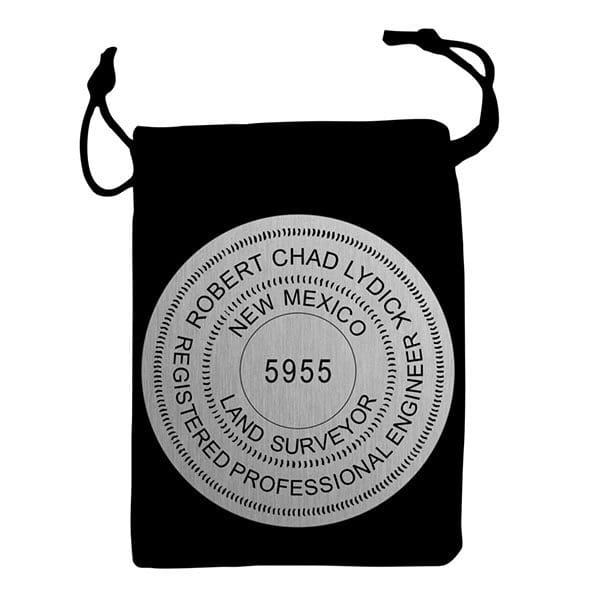 A black bag with a silver seal on it