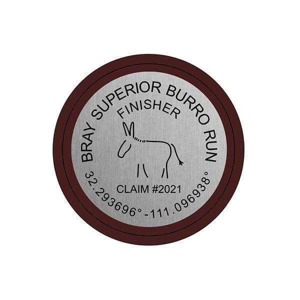 A brown and white sticker with the words bray superior burro run
