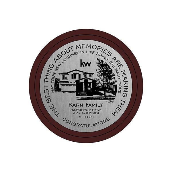 A round silver plaque with the words 