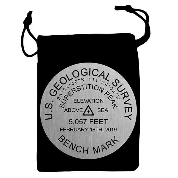 A black bag with a silver label on it