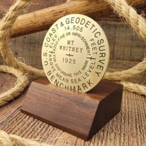 A wooden plaque with rope around it
