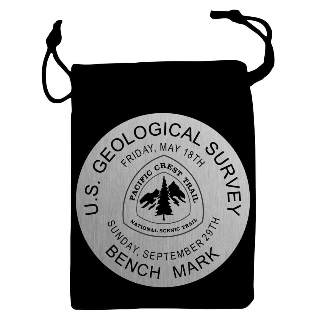 A black bag with a patch of the u. S. Geological survey logo on it